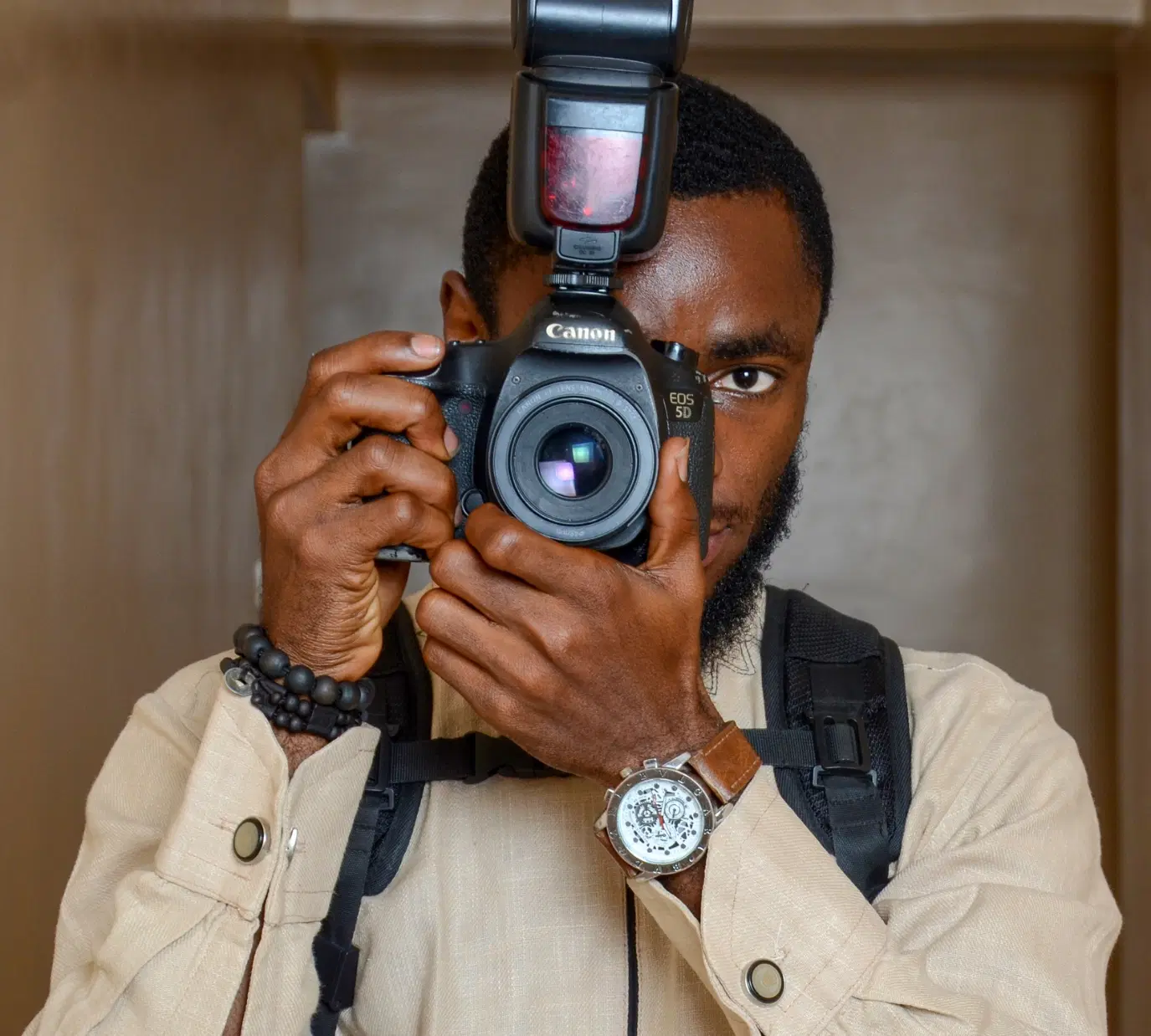 Nigerian photographer holding a camera